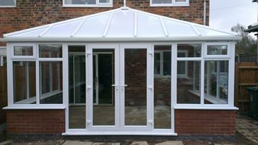 Edwardian conservatory with opel poly carb roof.